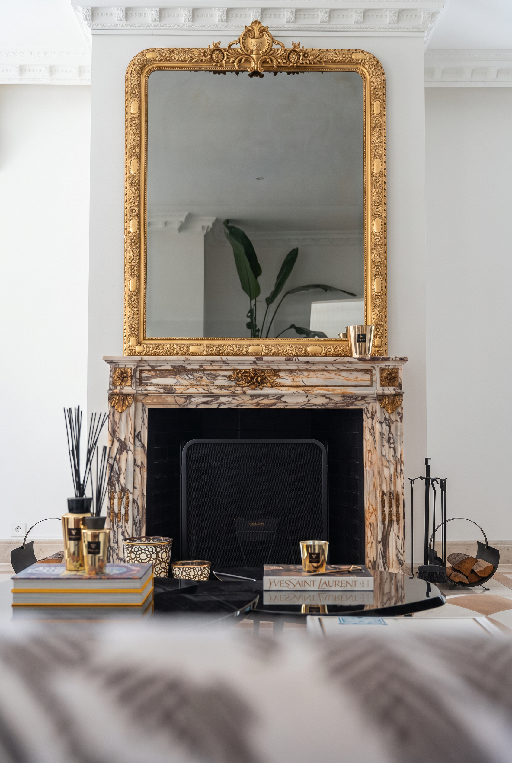 Marble fireplace with gilded mirror