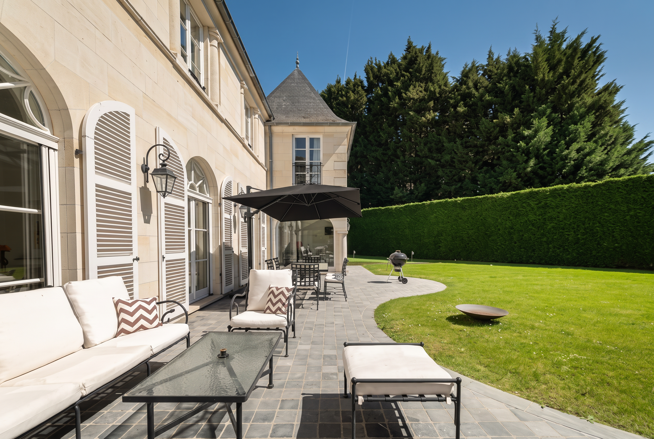 Shaded terrace along the facade